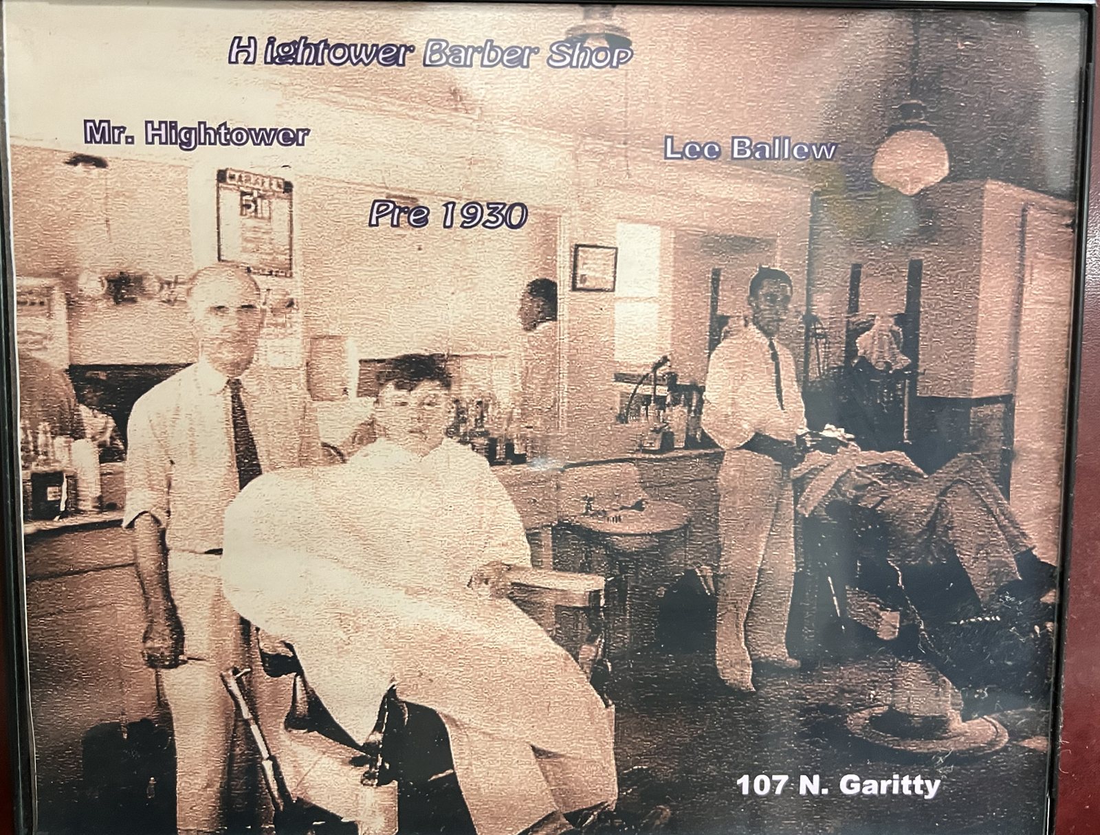 Hightower Barber Shop, 107 N. Garitty, before 1930. The chair is at the Frost Heritage Center now.