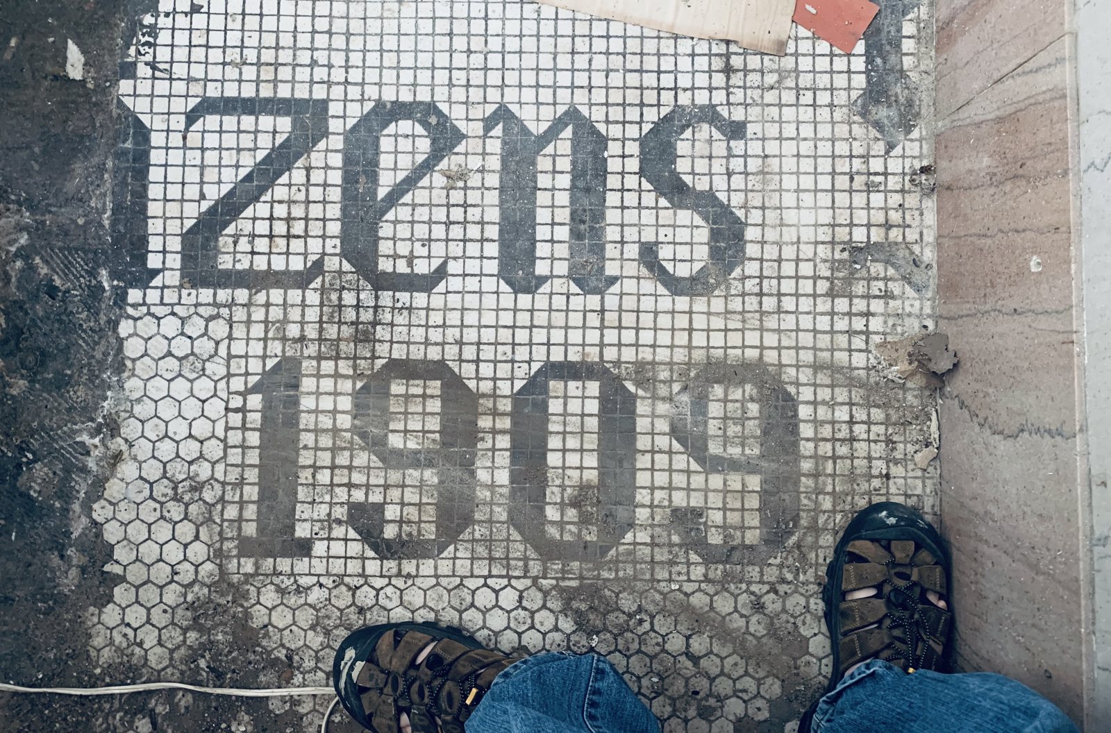 What the floor still says, just inside the old entrance. March 2021.